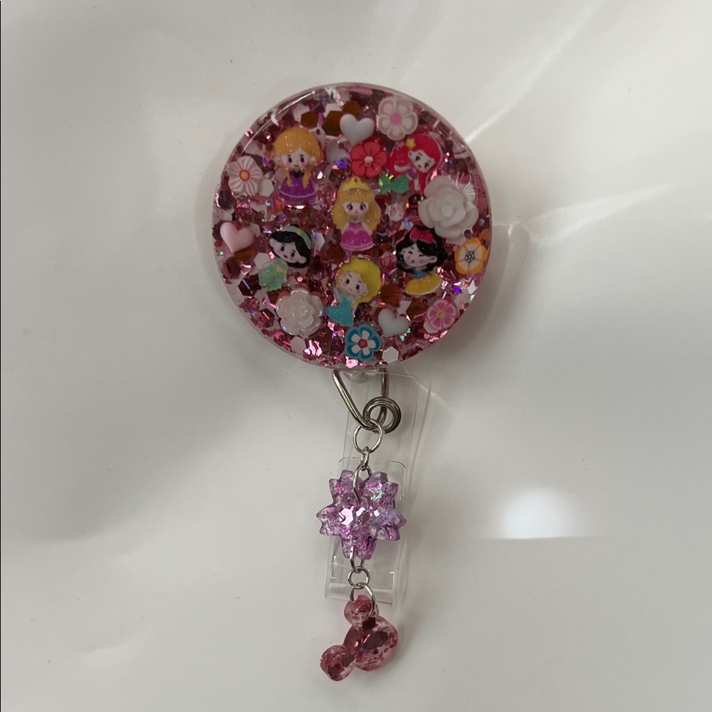 New Disney Princess Pink Glitter Badge Reel with Cute Characters and charms